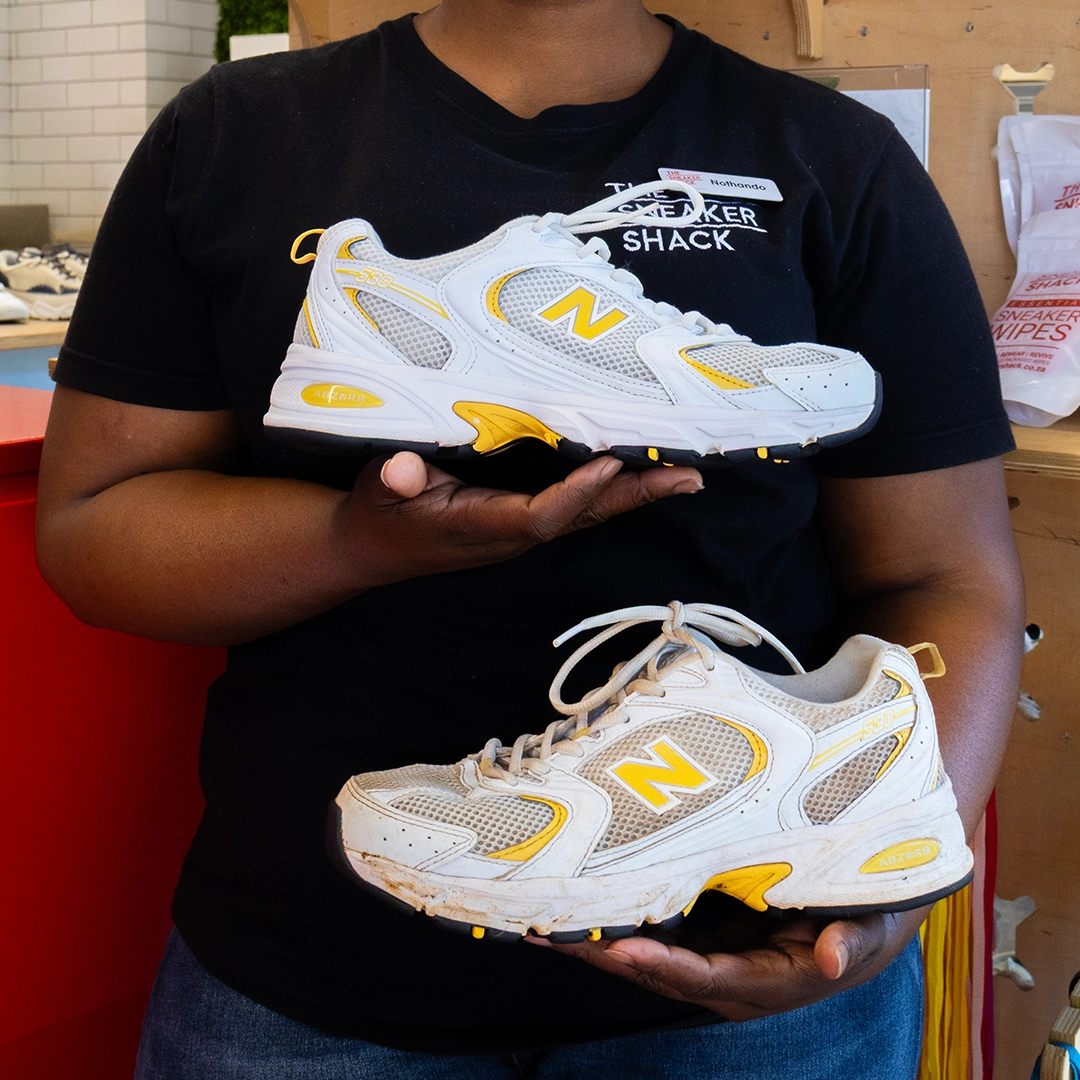 Before and after cleaning of a white and yellow New Balance running shoe at The Sneaker Shack