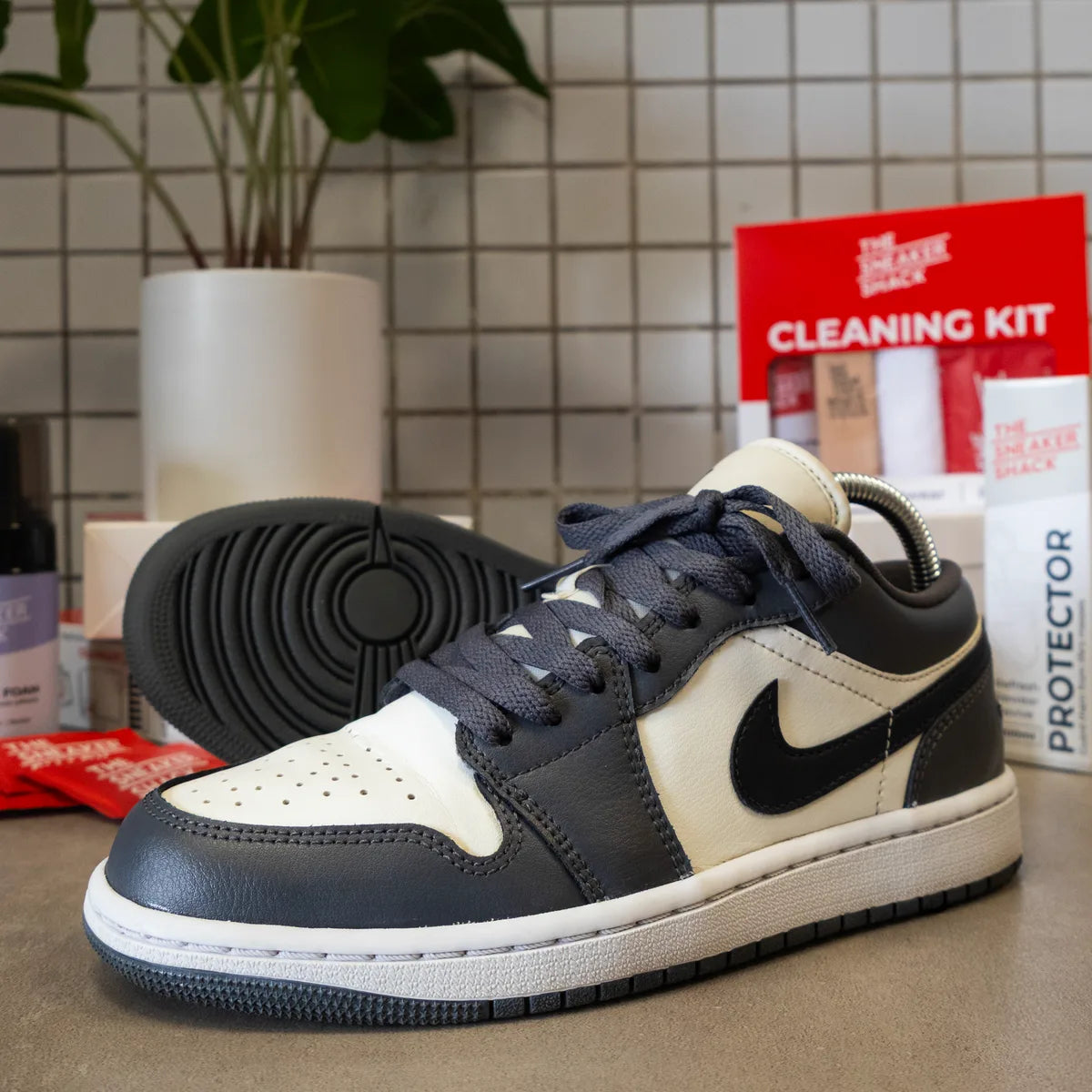 Restored navy and cream Air Jordan 1 Low at The Sneaker Shack