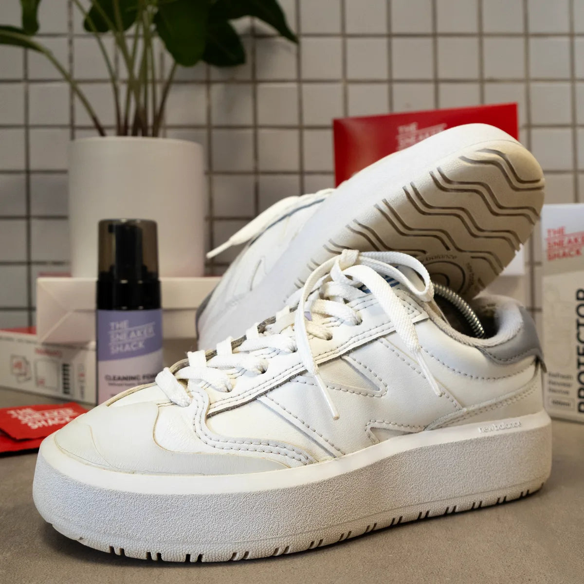 Restored white New Balance sneakers at The Sneaker Shack